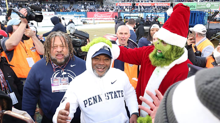 Penn State Nittany Lions interim head coach Terry Smith celebrates after defeating the Clemson Tigers in the 2025 Pinstripe Bowl at Yankee Stadium.