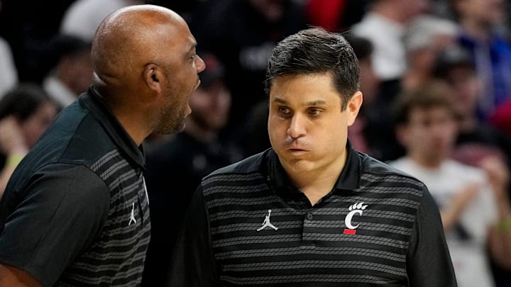 Cincinnati Bearcats head coach Wes Miller reacts as the Bearcats hold on to a narrow lead in the second half of the 92nd Annual Crosstown Shootout NCAA basketball game between the Cincinnati Bearcats and the Xavier Musketeers at Fifth Third Arena on the UC campus in Cincinnati on Saturday, Dec. 14, 2024. The Bearcats won 68-65. Cincinnati Bearcats head coach Wes Miller reacts as the Bearcats hold on to a narrow lead in the second half of the 92nd Annual Crosstown Shootout NCAA basketball game between the Cincinnati Bearcats and the Xavier Musketeers at Fifth Third Arena on the UC campus in Cincinnati on Saturday, Dec. 14, 2024. The Bearcats won 68-65.