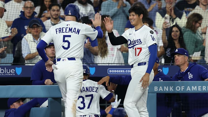 Apr 11, 2025; Los Angeles, California, USA; Los Angeles Dodgers designated hitter Shohei Ohtani (17) celebrates with first baseman Freddie Freeman (5) after a run during the sixth inning against the Chicago Cubs at Dodger Stadium. Mandatory Credit: Kiyoshi Mio-Imagn Images Apr 11, 2025; Los Angeles, California, USA; Los Angeles Dodgers designated hitter Shohei Ohtani (17) celebrates with first baseman Freddie Freeman (5) after a run during the sixth inning against the Chicago Cubs at Dodger Stadium. Mandatory Credit: Kiyoshi Mio-Imagn Images