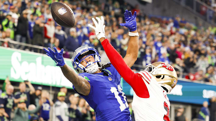Oct 10, 2024; Seattle, Washington, USA; San Francisco 49ers cornerback Deommodore Lenoir (2) breaks a up a potential touchdown pass to Seattle Seahawks wide receiver Jaxon Smith-Njigba (11) during the second quarter at Lumen Field. Mandatory Credit: Joe Nicholson-Imagn Images