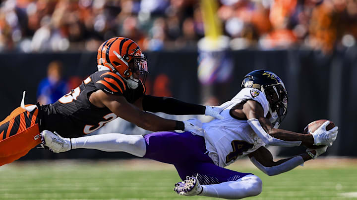 Oct 6, 2024; Cincinnati, Ohio, USA; Baltimore Ravens wide receiver Zay Flowers (4) catches a pass against Cincinnati Bengals cornerback Jalen Davis (35) in the second half at Paycor Stadium. Mandatory Credit: Katie Stratman-Imagn Images
