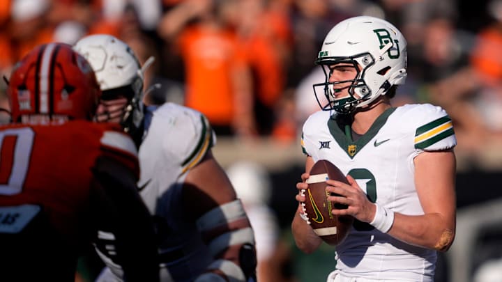 Baylor's Sawyer Robertson (13) looks to pass the ball in the second half of the college football game between the Oklahoma State Cowboys and the Baylor Bears at Boone Pickens Stadium in Stillwater, Okla., Saturday, Sept. 27, 2025.