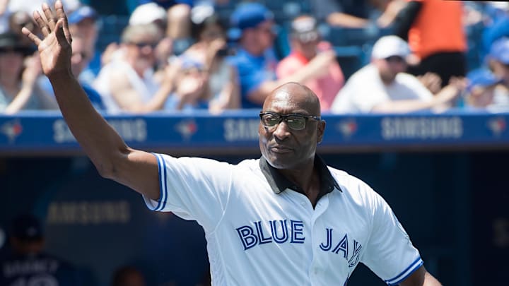 Former Toronto Blue Jays player Lloyd Moseby waves while wearing a white jersey. Former Toronto Blue Jays player Lloyd Moseby waves while wearing a white jersey.