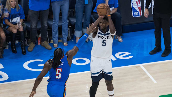 May 22, 2025; Oklahoma City, Oklahoma, USA; Minnesota Timberwolves guard Anthony Edwards (5) shoots against Oklahoma City Thunder guard Luguentz Dort (5) in the fourth quarter during game two of the western conference finals for the 2025 NBA Playoffs at Paycom Center. Mandatory Credit: Brett Rojo-Imagn Images May 22, 2025; Oklahoma City, Oklahoma, USA; Minnesota Timberwolves guard Anthony Edwards (5) shoots against Oklahoma City Thunder guard Luguentz Dort (5) in the fourth quarter during game two of the western conference finals for the 2025 NBA Playoffs at Paycom Center. Mandatory Credit: Brett Rojo-Imagn Images