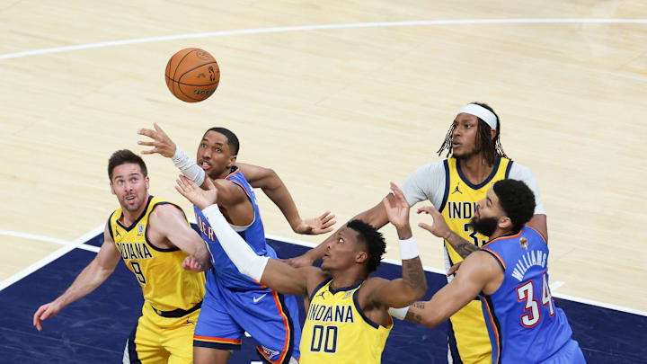 Jun 19, 2025; Indianapolis, Indiana, USA; Oklahoma City Thunder guard Aaron Wiggins (21) goes after a loose ball against Indiana Pacers guard T.J. McConnell (9) and guard Bennedict Mathurin (00) in the fourth quarter during game six of the 2025 NBA Finals at Gainbridge Fieldhouse. Mandatory Credit: Trevor Ruszkowski-Imagn Images Jun 19, 2025; Indianapolis, Indiana, USA; Oklahoma City Thunder guard Aaron Wiggins (21) goes after a loose ball against Indiana Pacers guard T.J. McConnell (9) and guard Bennedict Mathurin (00) in the fourth quarter during game six of the 2025 NBA Finals at Gainbridge Fieldhouse. Mandatory Credit: Trevor Ruszkowski-Imagn Images