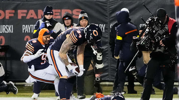 Dec 20, 2025; Chicago, Illinois, USA; Chicago Bears wide receiver DJ Moore (2) reacts with tight end Colston Loveland (84) and cornerback Tyrique Stevenson (29) in the end zone after scoring the game-winning touchdown against the Green Bay Packers in overtime at Soldier Field. Mandatory Credit: David Banks-Imagn Images