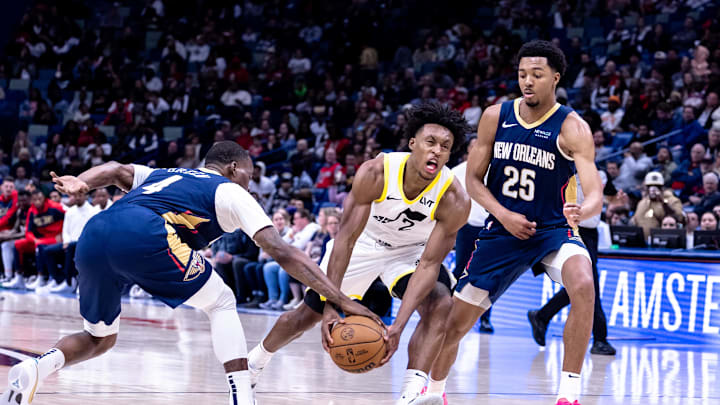 Jan 17, 2025; New Orleans, Louisiana, USA; Utah Jazz guard Collin Sexton (2) has the ball stripped by New Orleans Pelicans guard Javonte Green (4) during the second half at Smoothie King Center. Mandatory Credit: Stephen Lew-Imagn Images