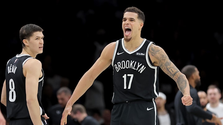Dec 1, 2025; Brooklyn, New York, USA; Brooklyn Nets forward Michael Porter Jr. (17) reacts with guard Egor Demin (8) during the fourth quarter against the Charlotte Hornets at Barclays Center. Mandatory Credit: Brad Penner-Imagn Images