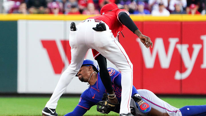 Cincinnati Reds shortstop Elly De La Cruz (44) tags out New York Mets shortstop Fancisco Lindor (12) in the first inning of a MLB game between the Cincinnati Reds and New York Mets, Saturday, Sept. 6, 2025, at Great American Ball Park in downtown Cincinnati.