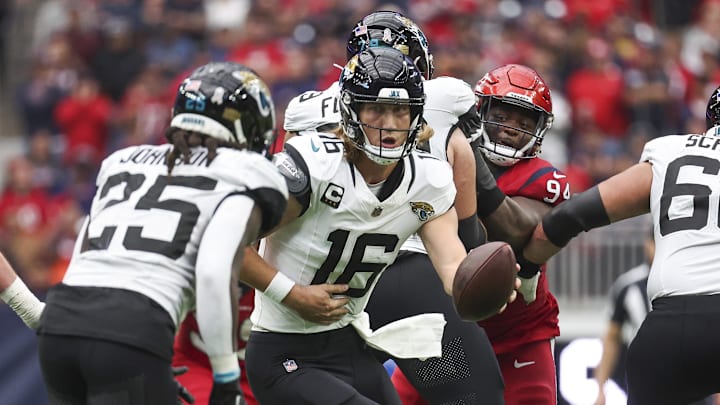 Nov 26, 2023; Houston, Texas, USA; Jacksonville Jaguars quarterback Trevor Lawrence (16) drops back with the ball during the third quarter against the Houston Texans at NRG Stadium. Mandatory Credit: Troy Taormina-Imagn Images