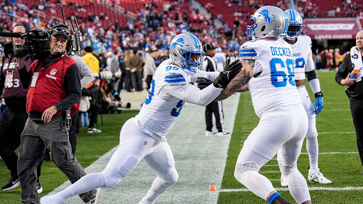 Detroit Lions defensive end Za'Darius Smith (99), left, practices with offensive tackle Taylor Decker (68) at warm up before the game between San Francisco 49ers and Detroit Lions at Levi's Stadium in Santa Clara, Calif. on Monday, Dec. 30, 2024.