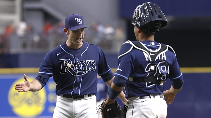 Sep 22, 2021; St. Petersburg, Florida, USA; Tampa Bay Rays relief pitcher David Robertson (30) and Tampa Bay Rays catcher Francisco Mejia (28) celebrate as they beat the Toronto Blue Jays to clinch a playoff spot at Tropicana Field. Mandatory Credit: Kim Klement-Imagn Images