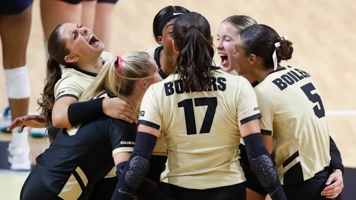 Purdue Boilermakers celebrate during the NCAA women’s volleyball match against the Penn St. Nittany Lions