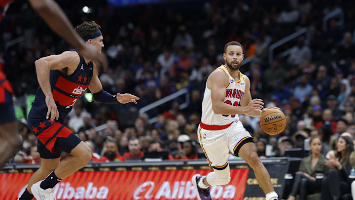 Nov 4, 2024; Washington, District of Columbia, USA; Golden State Warriors guard Stephen Curry (30) drives to the basket as Washington Wizards forward Corey Kispert (24) defends in the second half at Capital One Arena. Mandatory Credit: Geoff Burke-Imagn Images