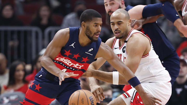Jan 10, 2025; Chicago, Illinois, USA; Chicago Bulls forward Talen Horton-Tucker (22) defends against Washington Wizards guard Jared Butler (4) during the first half at United Center. Mandatory Credit: Kamil Krzaczynski-Imagn Images
