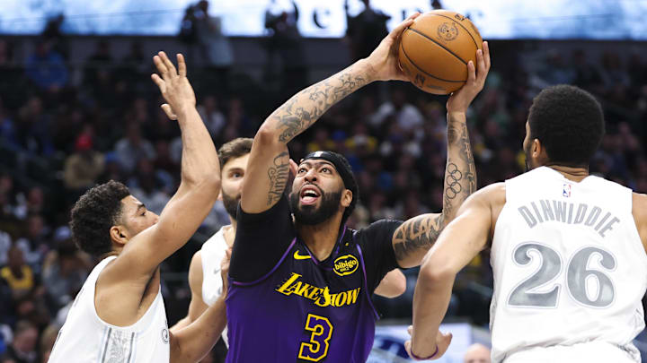 Jan 7, 2025; Dallas, Texas, USA; Los Angeles Lakers forward Anthony Davis (3) shoots over Dallas Mavericks guard Quentin Grimes (5) during the second half at American Airlines Center. Mandatory Credit: Kevin Jairaj-Imagn Images