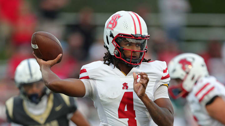 Spalding quarterback Malik Washington throws against Hoban during the first half of a high school football game, Friday, Aug. 23, 2024, in Akron, Ohio. Spalding quarterback Malik Washington throws against Hoban during the first half of a high school football game, Friday, Aug. 23, 2024, in Akron, Ohio.