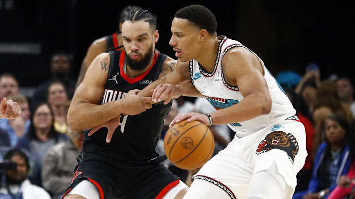 Memphis Grizzlies guard Desmond Bane dribbles as Houston Rockets forward Dillon Brooks defends. Memphis Grizzlies guard Desmond Bane dribbles as Houston Rockets forward Dillon Brooks defends.