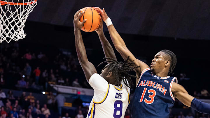 Jan 29, 2025; Baton Rouge, Louisiana, USA;  Auburn Tigers guard Miles Kelly (13) misses the blocked shot of LSU Tigers forward Trey'Dez Green (8) during the first half at Pete Maravich Assembly Center. Mandatory Credit: Stephen Lew-Imagn Images