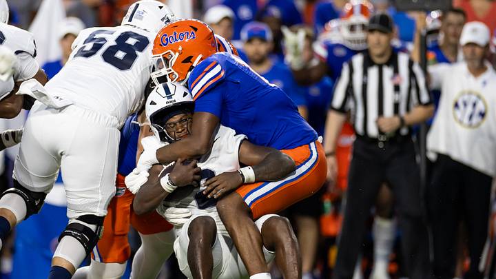 Sep 7, 2024; Gainesville, Florida, USA; Florida Gators edge LJ McCray (17) tackles Samford Bulldogs quarterback Quincy Crittendon (2) during the first half at Ben Hill Griffin Stadium. Mandatory Credit: Matt Pendleton-Imagn Images Sep 7, 2024; Gainesville, Florida, USA; Florida Gators edge LJ McCray (17) tackles Samford Bulldogs quarterback Quincy Crittendon (2) during the first half at Ben Hill Griffin Stadium. Mandatory Credit: Matt Pendleton-Imagn Images