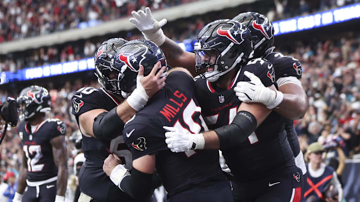 Nov 9, 2025; Houston, Texas, USA; Houston Texans quarterback Davis Mills (10) celebrates with teammates after scoring a touchdown against the Jacksonville Jaguars during the fourth quarter at NRG Stadium. Mandatory Credit: Troy Taormina-Imagn Images