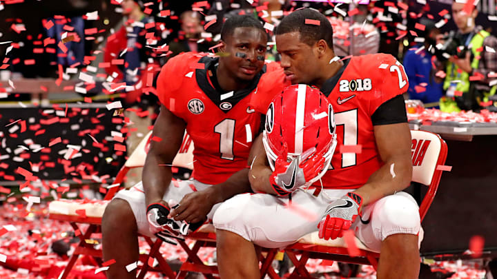 Jan 8, 2018; Atlanta, GA, USA; Georgia Bulldogs running back Sony Michel (1) and Georgia Bulldogs running back Nick Chubb (27) react after loosing to the Alabama Crimson Tide in the 2018 CFP national championship college football game at Mercedes-Benz Stadium. Mandatory Credit: Jason Getz-Imagn Images