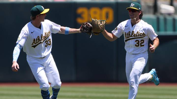 Jun 21, 2026; West Sacramento, California, USA; Athletics center fielder Henry Bolte (33) celebrates with Athletics right fielder Colby Thomas (32) after Thomas catch during the first inning against the Los Angeles Angels at Sutter Health Park. Mandatory Credit: Scott Marshall-Imagn Images Jun 21, 2026; West Sacramento, California, USA; Athletics center fielder Henry Bolte (33) celebrates with Athletics right fielder Colby Thomas (32) after Thomas catch during the first inning against the Los Angeles Angels at Sutter Health Park. Mandatory Credit: Scott Marshall-Imagn Images
