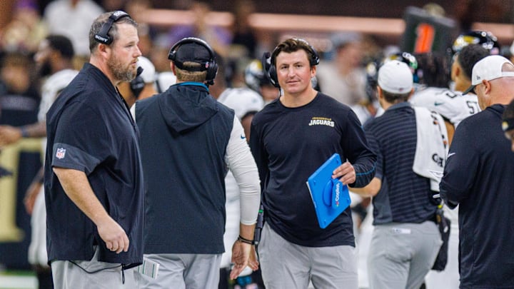 Aug 17, 2025; New Orleans, Louisiana, USA; Jacksonville Jaguars offensive coordinator Grant Udinski (blue binder) reacts to a touchdown against the New Orleans Saints during the first half at Caesars Superdome. Mandatory Credit: Stephen Lew-Imagn Images Aug 17, 2025; New Orleans, Louisiana, USA; Jacksonville Jaguars offensive coordinator Grant Udinski (blue binder) reacts to a touchdown against the New Orleans Saints during the first half at Caesars Superdome. Mandatory Credit: Stephen Lew-Imagn Images
