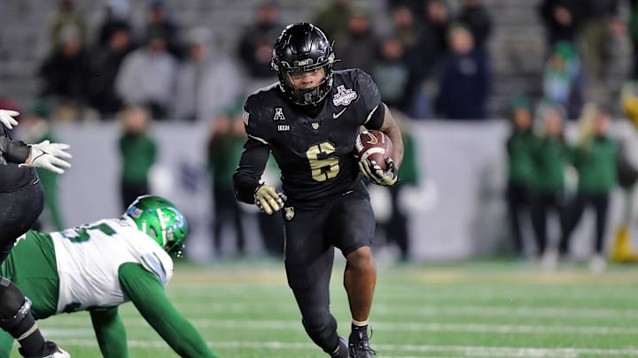 Dec 6, 2024; West Point, NY, USA; Army Black Knights running back Kanye Udoh (6) runs the ball against the Tulane Green Wave during the second half at Michie Stadium. Mandatory Credit: Danny Wild-Imagn Images
