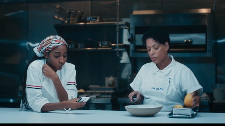 The Bear - Season 4 -- Pictured: (l-r) Ayo Edebiri as Sydney Adamu, Liza Colon-Zayas as Tina. CR: FX