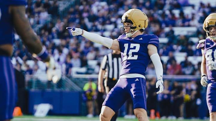 Alex McLaughlin celebrates his 80-yard Spring Game interception.