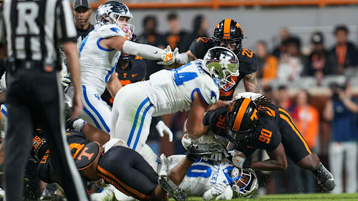 Tennessee defensive lineman Dominic Bailey (90) tackles Kentucky running back Jamarion Wilcox (10) during a NCAA football game between Tennessee and Kentucky in Neyland Stadium on Saturday, Nov. 2, 2024.