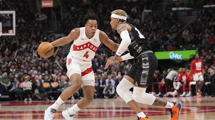 Feb 12, 2024; Toronto, Ontario, CAN;  Toronto Raptors forward Scottie Barnes (4) tries to get around