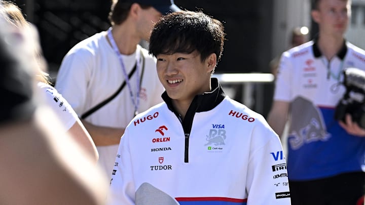 Oct 18, 2024; Austin, Texas, USA; Visa Cash App RB Formula One Team driver Yuki Tsunoda (22) of Team Japan walks through the paddock area before practice for the 2024 US Grand Prix at Circuit of the Americas. Mandatory Credit: Jerome Miron-Imagn Images