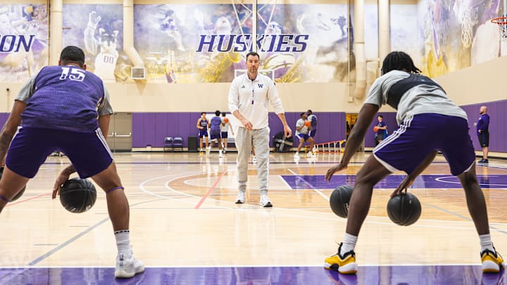 Washington coach Danny Sprinkle observes a recent men's basketball practice at Washington's practice facility in Seattle.
