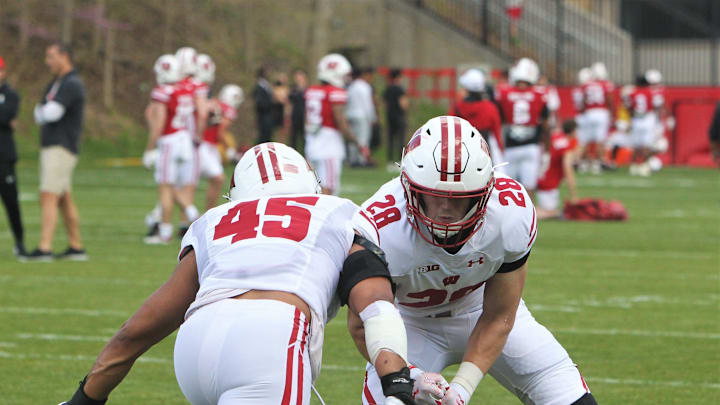 Wisconsin linebackers Garrison Solliday (45) and Christian Alliegro (28) warm-up before the team's intrasquad scrimmage on the field north of Camp Randall Stadium in Madison, Wisconsin on Saturday April 27, 2024.
