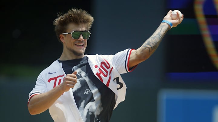 Jun 21, 2025; Minneapolis, Minnesota, USA; Minnesota safety Koi Perich throws out a ceremonial first pitch before the game between the Milwaukee Brewers and the Minnesota Twins at Target Field. Mandatory Credit: Bruce Kluckhohn-Imagn Images