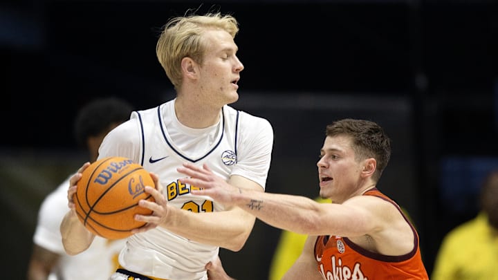 Jan 11, 2025; Berkeley, California, USA; (Editors Notes: Caption Correction) California Golden Bears forward Rytis Petraitis (31) controls the ball against Virginia Tech Hokies guard Brandon Rechsteiner (7) during the first half at Haas Pavilion. Mandatory Credit: D. Ross Cameron-Imagn Images