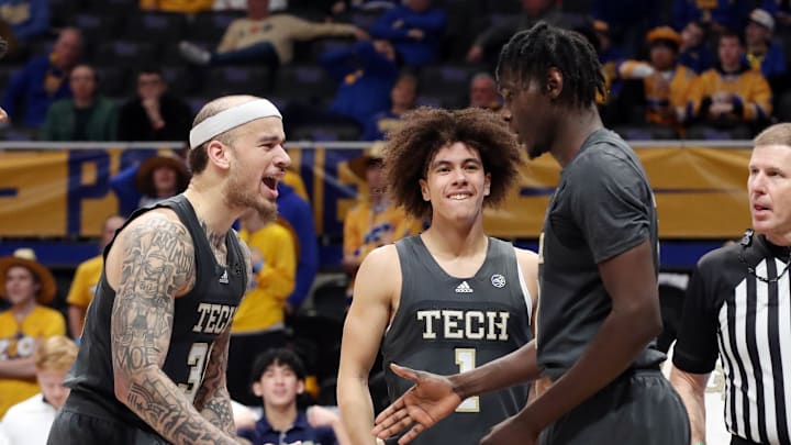 Feb 25, 2025; Pittsburgh, Pennsylvania, USA; Georgia Tech Yellow Jackets forward Duncan Powell (31), guard Naithan George (1) and forward Baye Ndongo (right) celebrate against the Pittsburgh Panthers during the second half at the Petersen Events Center. Mandatory Credit: Charles LeClaire-Imagn Images Feb 25, 2025; Pittsburgh, Pennsylvania, USA; Georgia Tech Yellow Jackets forward Duncan Powell (31), guard Naithan George (1) and forward Baye Ndongo (right) celebrate against the Pittsburgh Panthers during the second half at the Petersen Events Center. Mandatory Credit: Charles LeClaire-Imagn Images