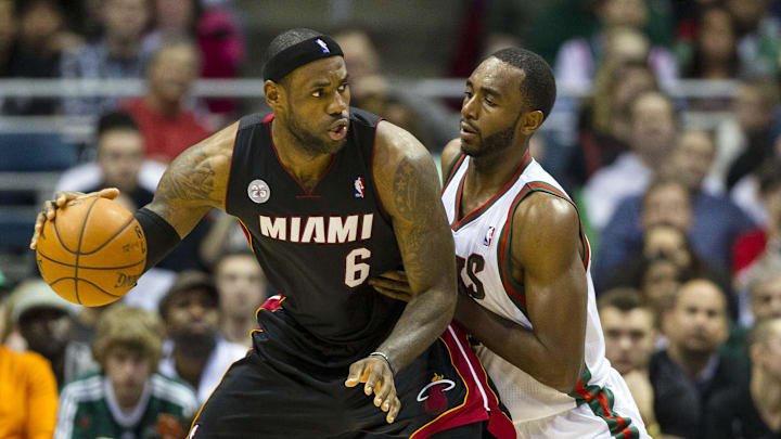 Dec 29, 2012; Milwaukee, WI, USA;  Miami Heat forward LeBron James (6) (left) posts up against Milwaukee Bucks forward Luc Richard Mbah a Moute (12) (right) during the third quarter at the BMO Harris Bradley Center.  Mandatory Credit: Jeff Hanisch-Imagn Images