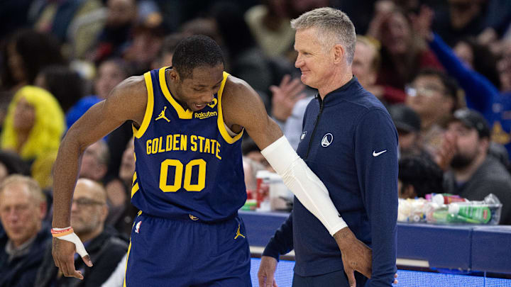 Jan 25, 2024; San Francisco, California, USA; Golden State Warriors forward Jonathan Kuminga (00) reacts after a foul with head coach Steve Kerr against the Sacramento Kings during the second quarter at Chase Center. Mandatory Credit: D. Ross Cameron-Imagn Images