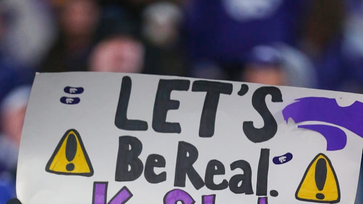 A Kansas State Wildcats fan cheers during the fourth quarter against the Baylor Bears. Mandatory Credit: Scott Sewell-Imagn Images A Kansas State Wildcats fan cheers during the fourth quarter against the Baylor Bears. Mandatory Credit: Scott Sewell-Imagn Images