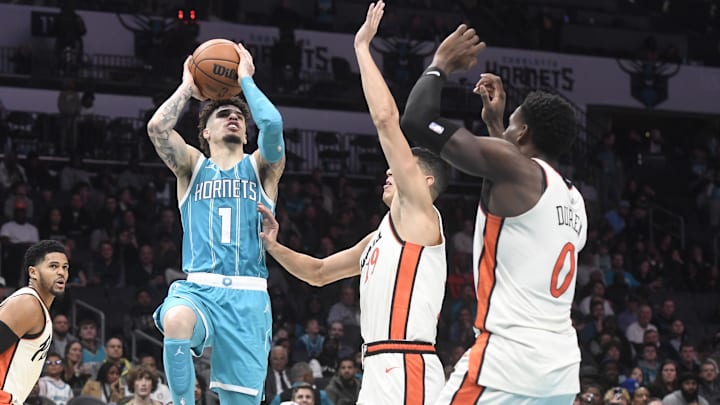 Nov 21, 2024; Charlotte, North Carolina, USA;  Charlotte Hornets guard LaMelo Ball (1) shoots during the second half against the Detroit Pistons at the Spectrum Center. Mandatory Credit: Sam Sharpe-Imagn Images