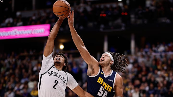 Dec 14, 2023; Denver, Colorado, USA; Brooklyn Nets forward Cam Johnson (2) and Denver Nuggets forward Aaron Gordon (50) battle for the ball in the third quarter at Ball Arena. Mandatory Credit: Isaiah J. Downing-Imagn Images