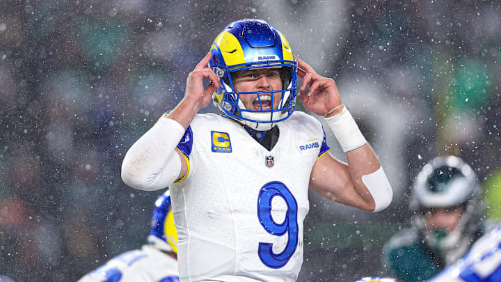 Jan 19, 2025; Philadelphia, Pennsylvania, USA; Los Angeles Rams quarterback Matthew Stafford (9) calls a play at the one of scrimmage against the Philadelphia Eagles in a 2025 NFC divisional round game at Lincoln Financial Field. Mandatory Credit: Bill Streicher-Imagn Images