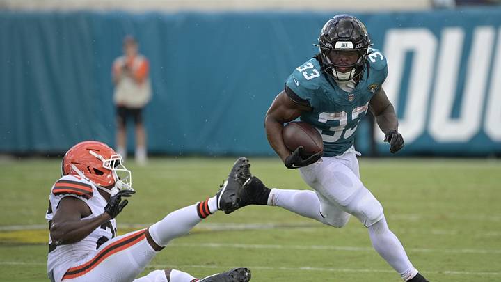 Sep 13, 2026; Jacksonville, Florida, USA; Jacksonville Jaguars running back Bhayshul Tuten (33) runs the ball against Cleveland Browns cornerback Myles Harden (26) in the third quarter at EverBank Stadium. Mandatory Credit: Melina Myers-Imagn Images Sep 13, 2026; Jacksonville, Florida, USA; Jacksonville Jaguars running back Bhayshul Tuten (33) runs the ball against Cleveland Browns cornerback Myles Harden (26) in the third quarter at EverBank Stadium. Mandatory Credit: Melina Myers-Imagn Images
