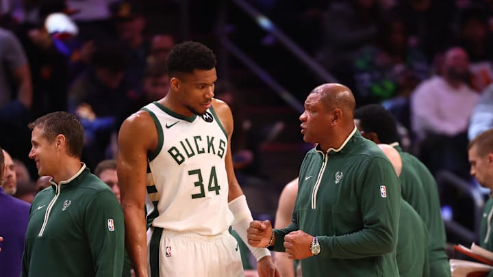 Feb 6, 2024; Phoenix, Arizona, USA; Milwaukee Bucks head coach Doc Rivers talks to forward Giannis Antetokounmpo (34) against the Phoenix Suns at Footprint Center. Mandatory Credit: Mark J. Rebilas-Imagn Images