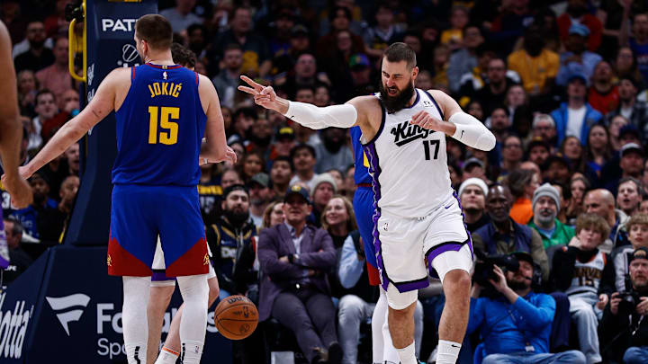 Mar 5, 2025; Denver, Colorado, USA; Sacramento Kings center Jonas Valanciunas (17) reacts after a play as Denver Nuggets center Nikola Jokic (15) looks on in the second quarter at Ball Arena. Mandatory Credit: Isaiah J. Downing-Imagn Images