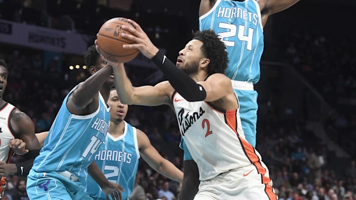 Nov 21, 2024; Charlotte, North Carolina, USA;  Detroit Pistons guard Cade Cunningham (2) drives in during the first half against the Charlotte Hornets at the Spectrum Center. Mandatory Credit: Sam Sharpe-Imagn Images