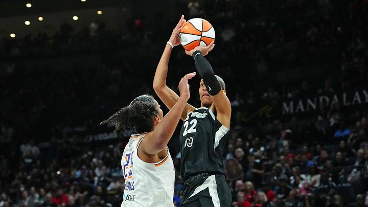 Oct 3, 2025; Las Vegas, Nevada, USA; Las Vegas Aces center A'ja Wilson (22) shoots against Phoenix Mercury forward Alyssa Thomas (25) during the fourth quarter of game one of the 2025 WNBA Finals at Michelob Ultra Arena. Mandatory Credit: Stephen R. Sylvanie-Imagn Images